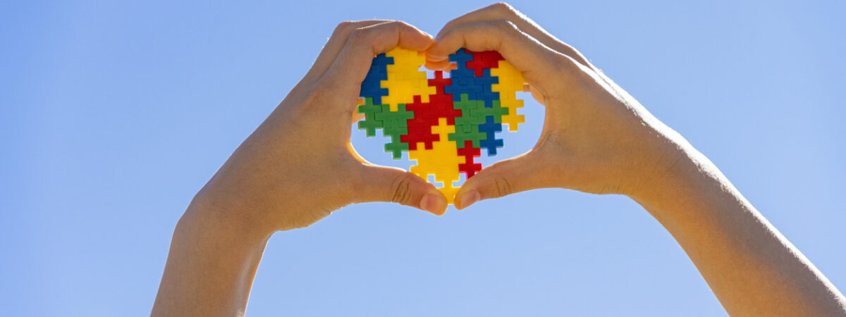 hands holding autism heart