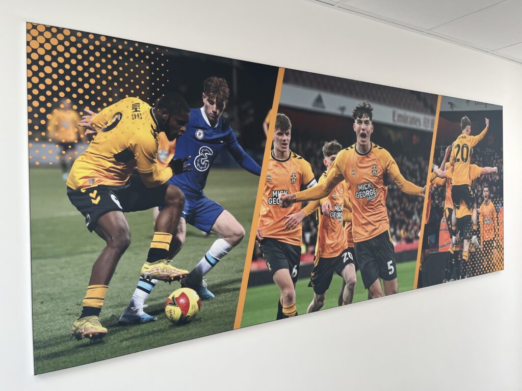 Scholar's Hall of Fame photo of players on the wall